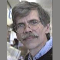 Frank Knight Middle-aged man with short dark and a salt-and-pepper mustache